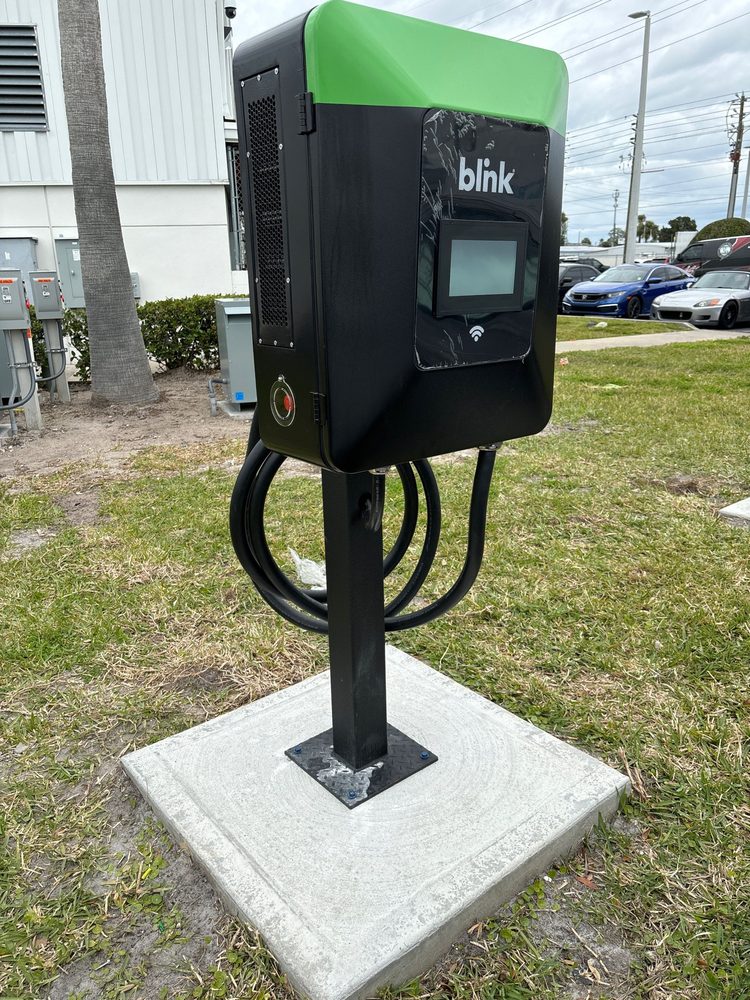 Commercial dual-port Blink Level 2 EV charging station installed by At Your Service Electric in New Port Richey FL