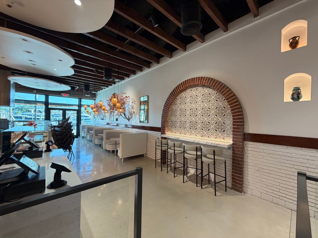 Restaurant interior lighting with arched tile feature wall by At Your Service Electric in Tarpon Springs FL